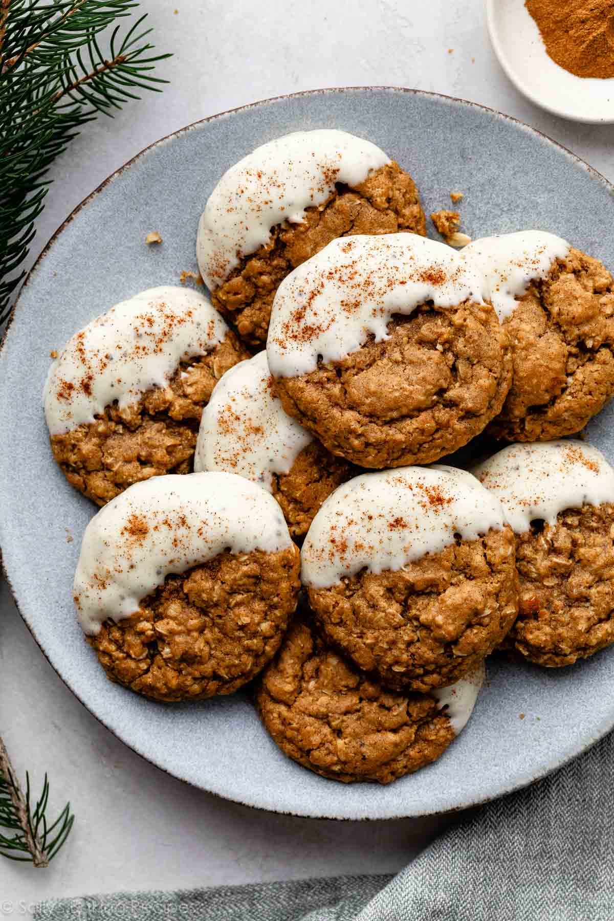 blue plate of white chocolate dipped gingerbread latte cookies.