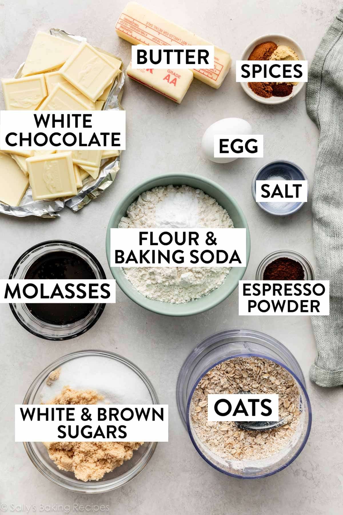 ingredients measured in bowls including spices, butter, molasses, flour, white and brown sugars, salt, and egg.