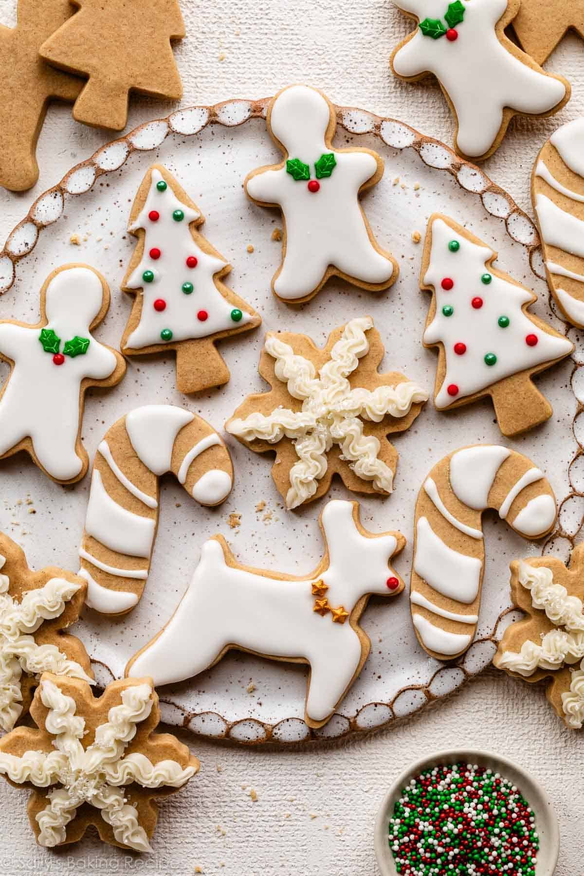 decorated brown sugar cut out cookies in Christmas shapes.