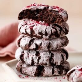 stack of chocolate raspberry crinkle cookies.