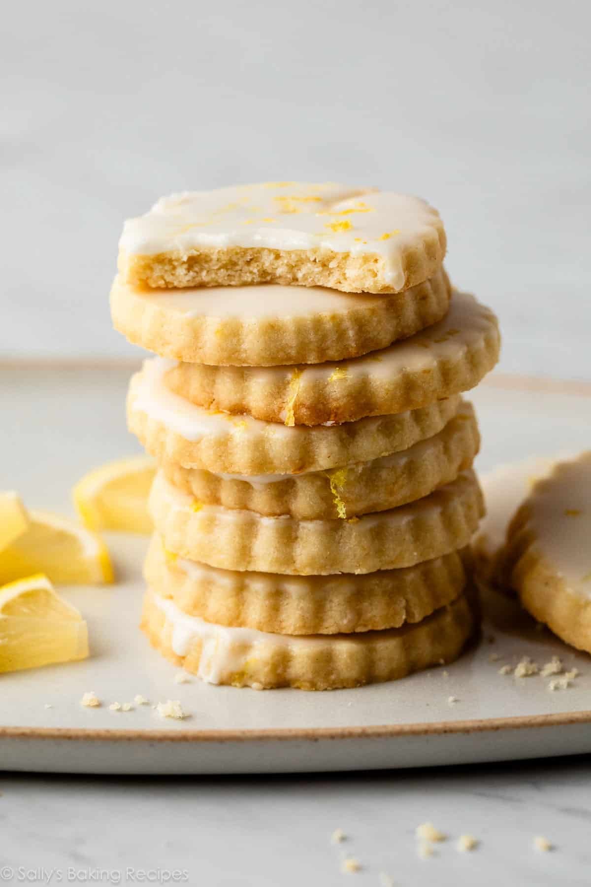 stack of iced lemon shortbread cookies.