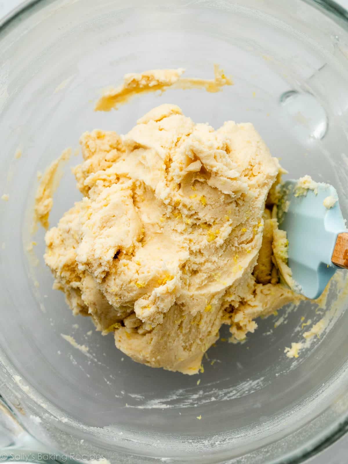 lemon cookie dough in glass bowl.