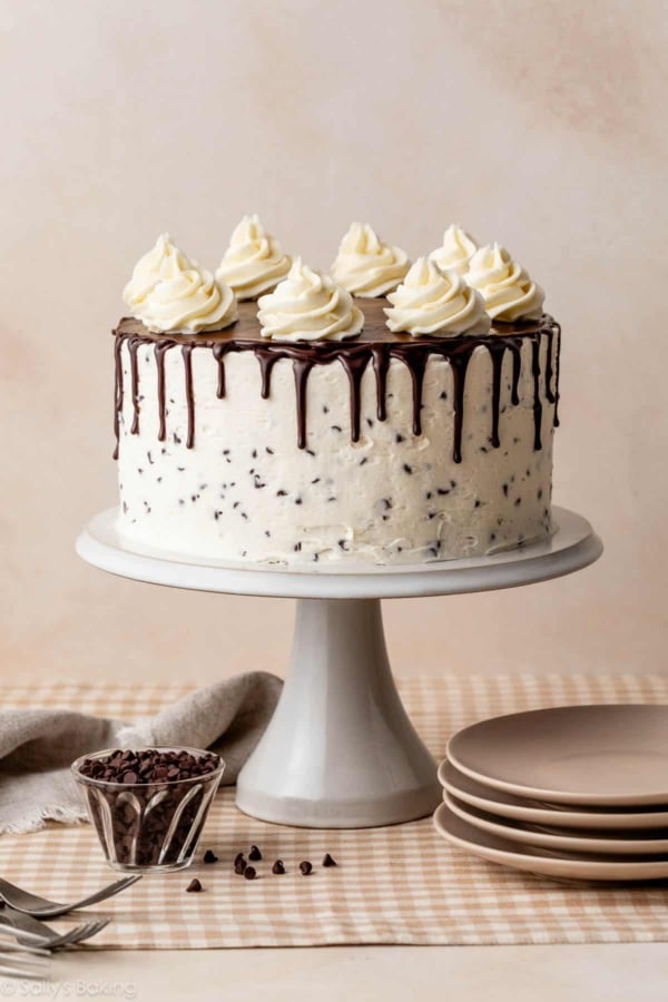 chocolate chip layer cake with buttercream and chocolate ganache drip.
