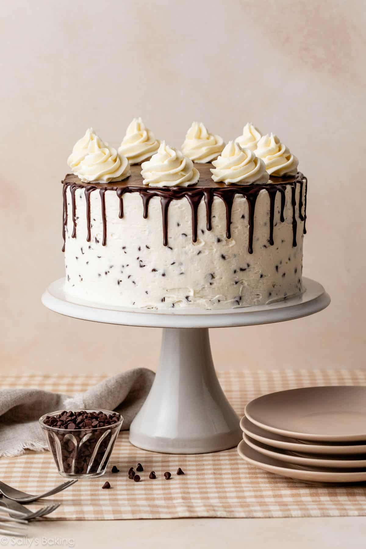 chocolate chip layer cake with buttercream and chocolate ganache drip.
