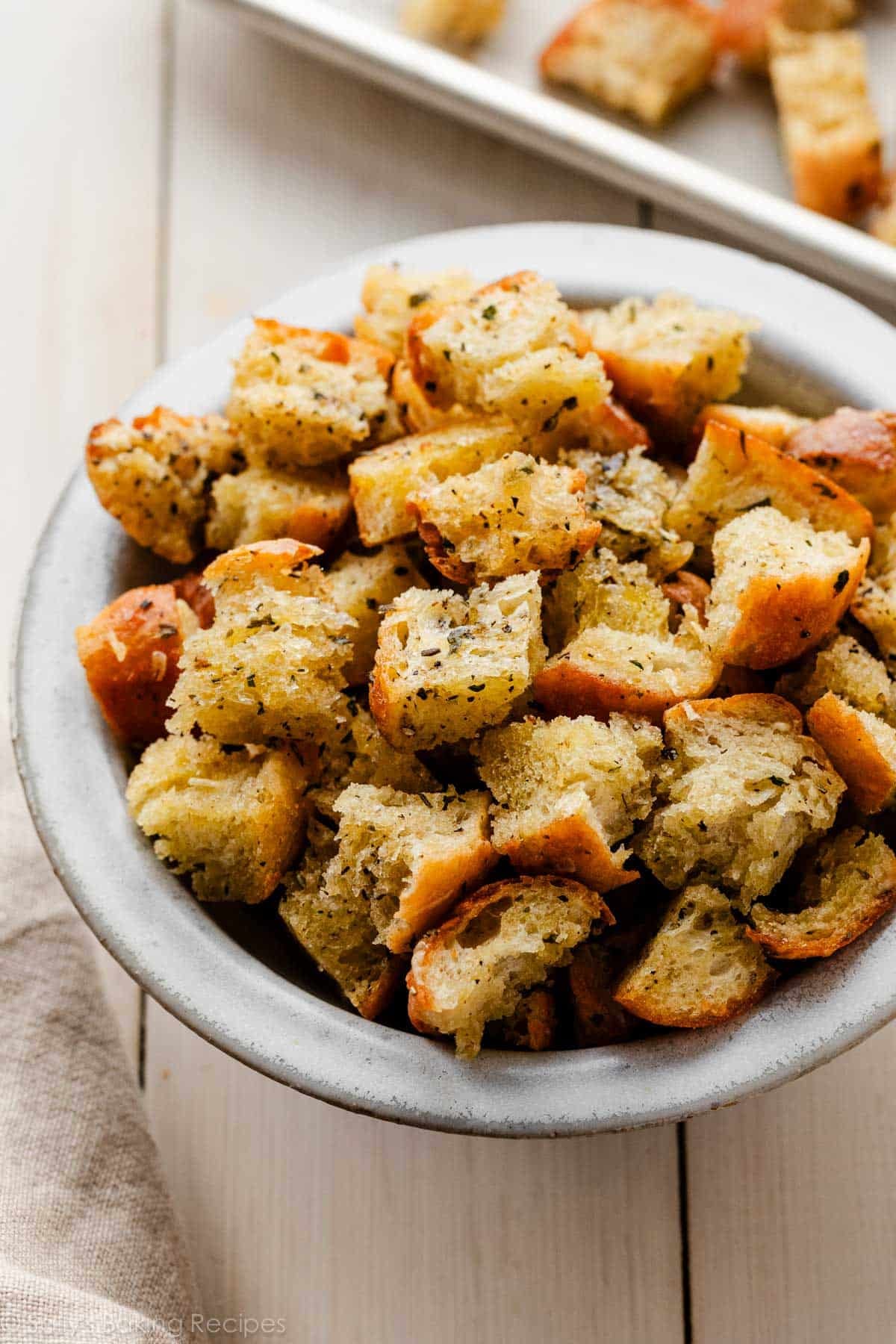 bowl of homemade garlic and herb croutons.