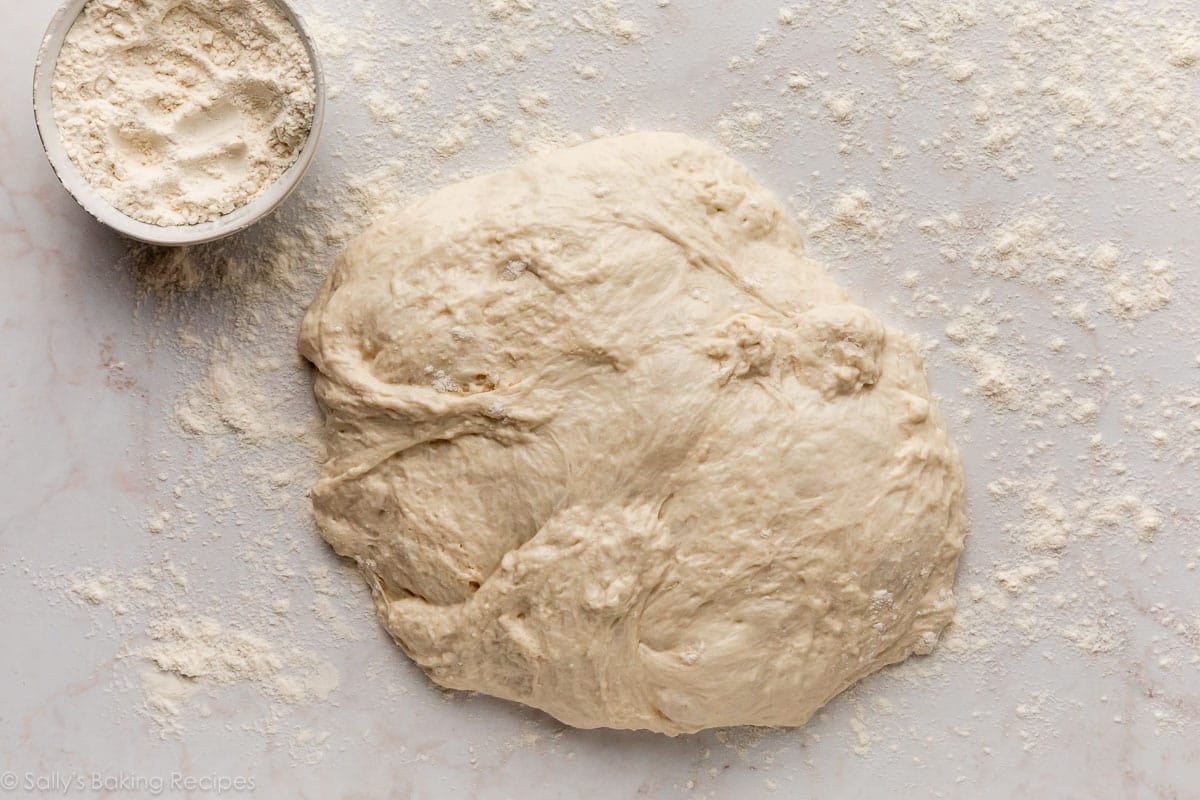 sticky dough on heavily-floured work surface counter.