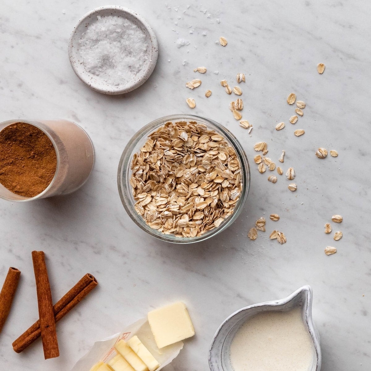 Overhead shot of oats, butter, milk, and cinnamon