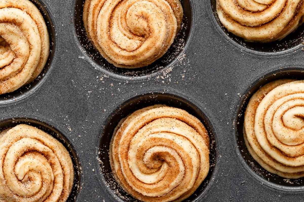 overhead image of cruffins in mufifn pan before baking.