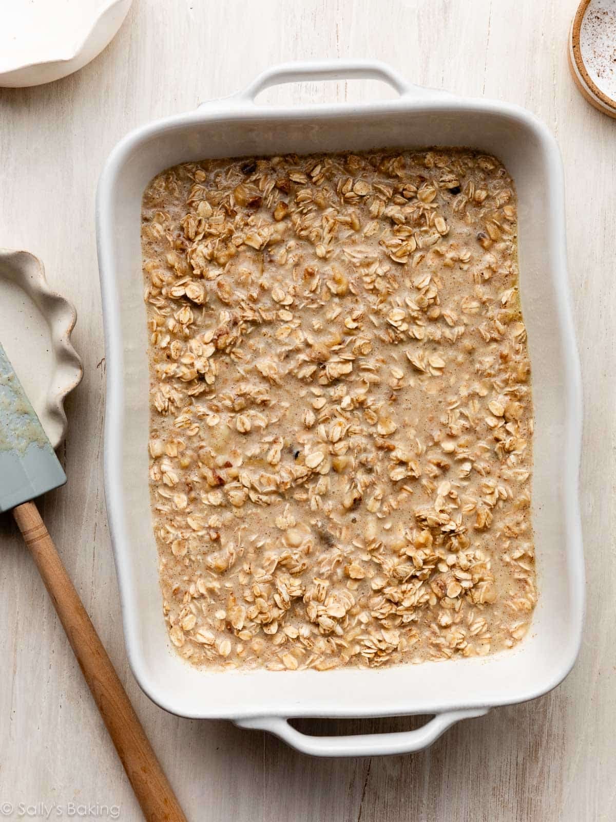 oatmeal mixture in white casserole dish.