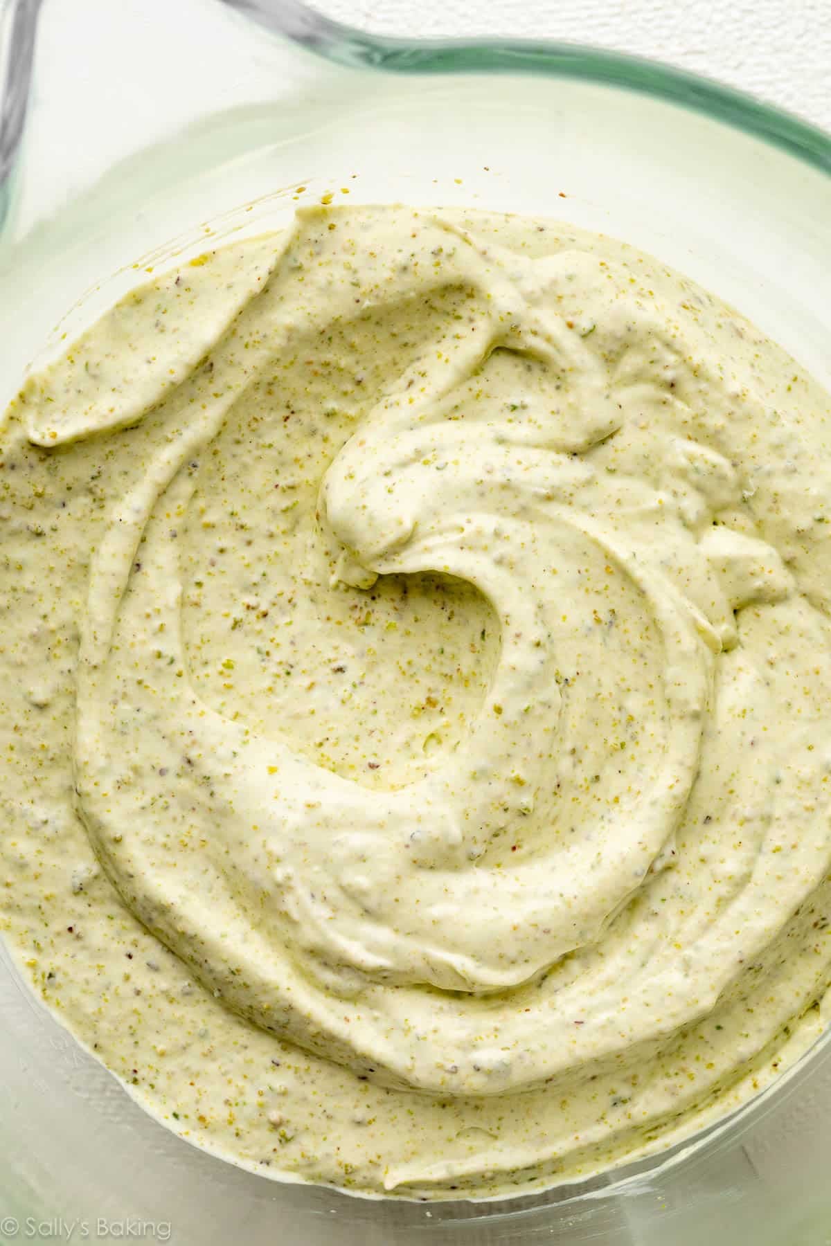 green pistachio ice cream mixture in glass bowl.