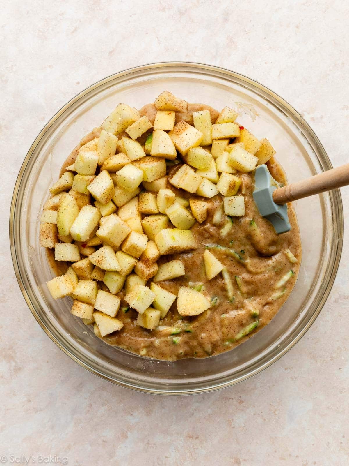batter in glass bowl with blue spatula.