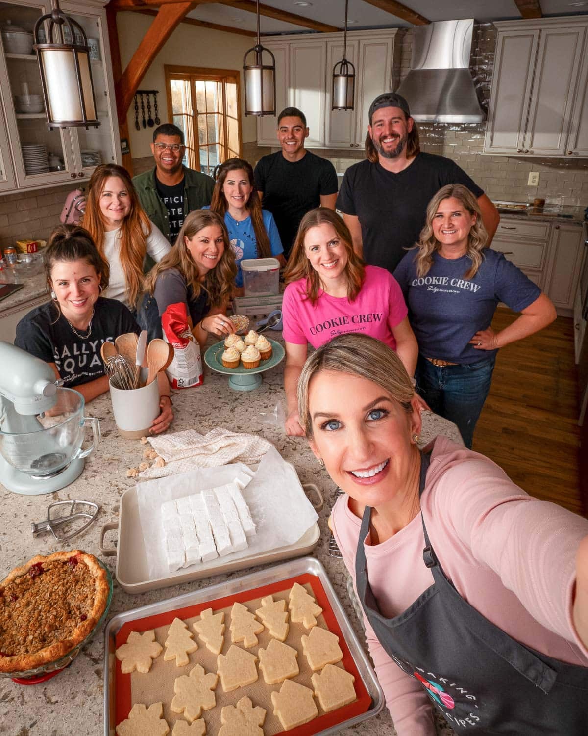 selfie of crew with baked goods.