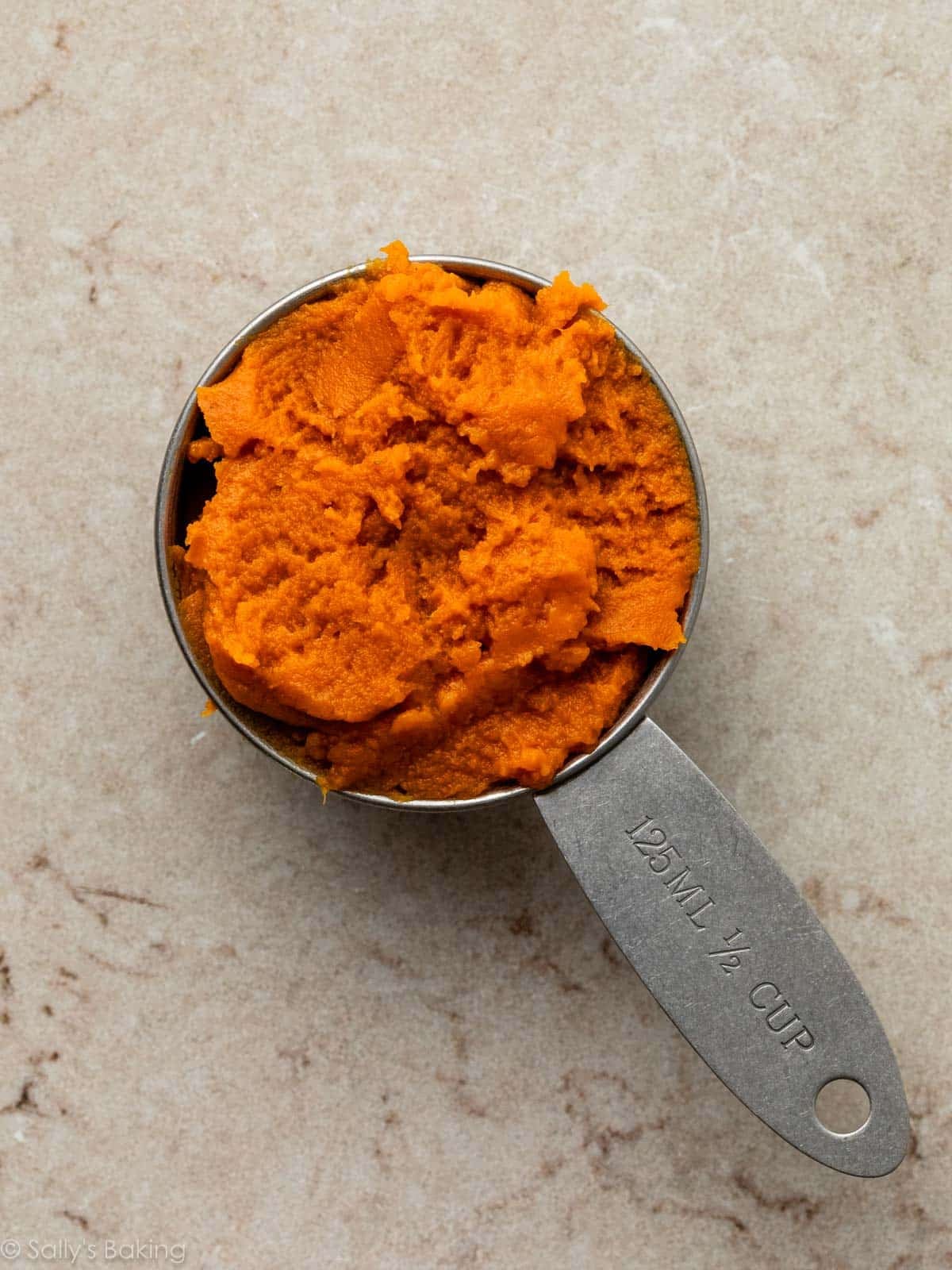 pumpkin in measuring cup.