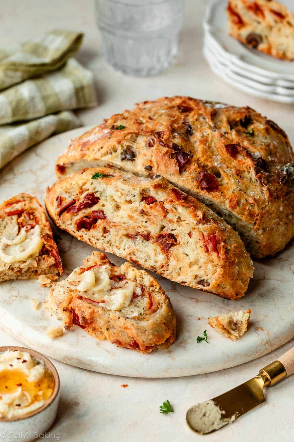 no-knead pizza bread sliced with spicy honey butter.