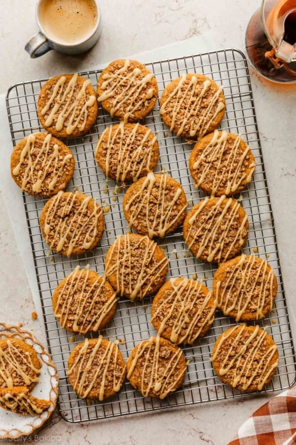 iced pumpkin crumb cake cookies on cooling rack.