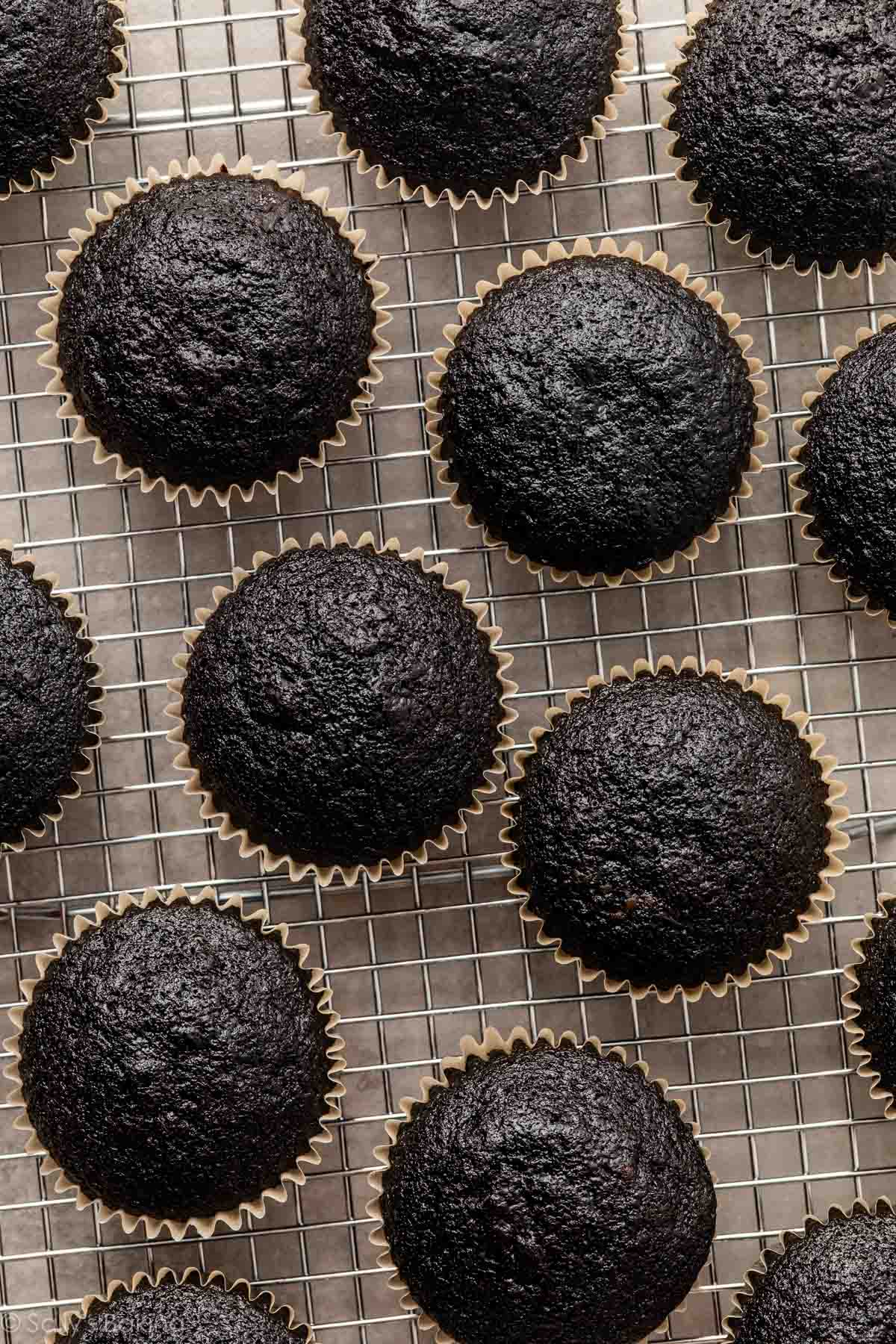black velvet cupcakes on cooling rack.