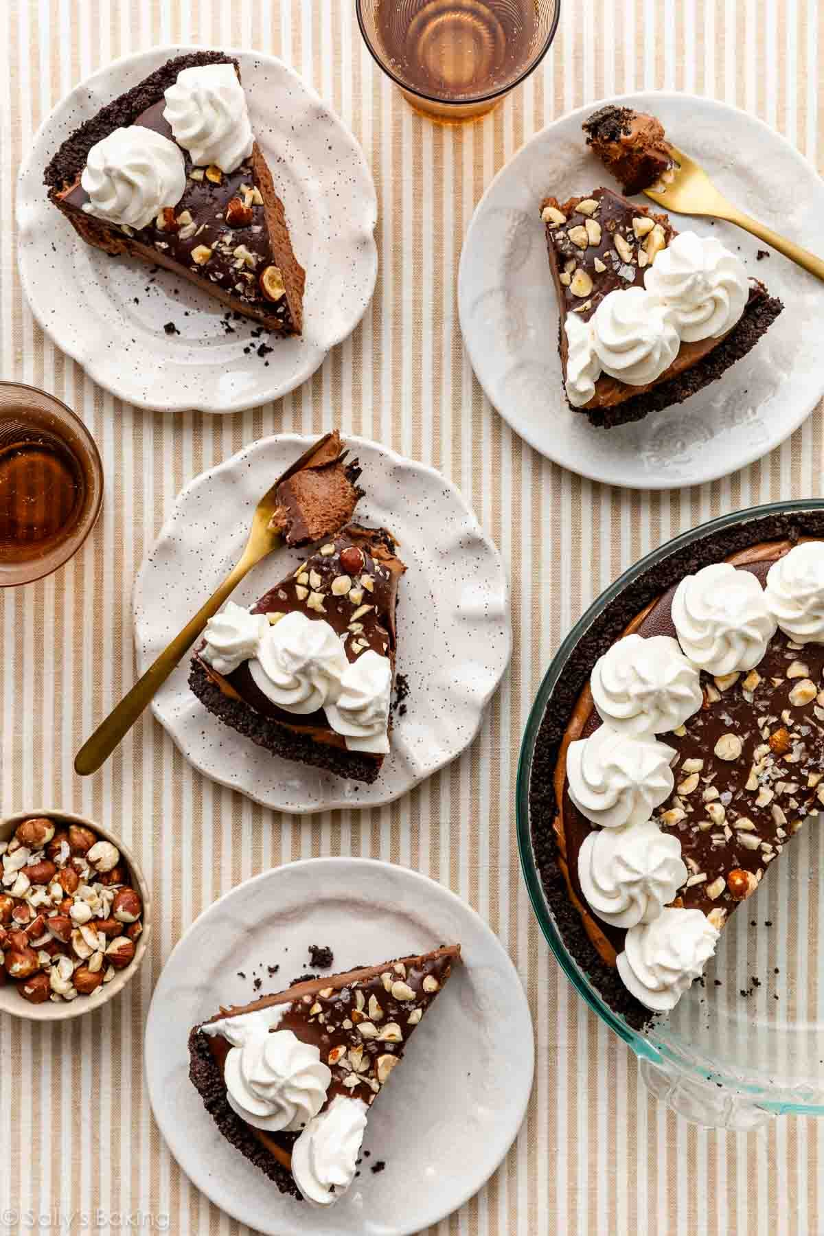 Nutella cream pie slices on white plates.