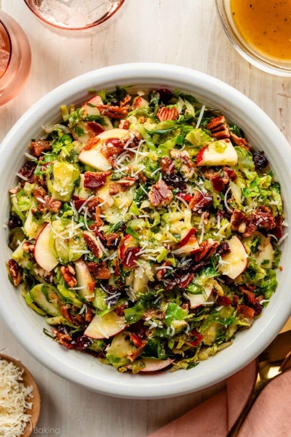 Brussels sprouts salad with bacon, apple, dried cranberries, pecan, and parmesan cheese.