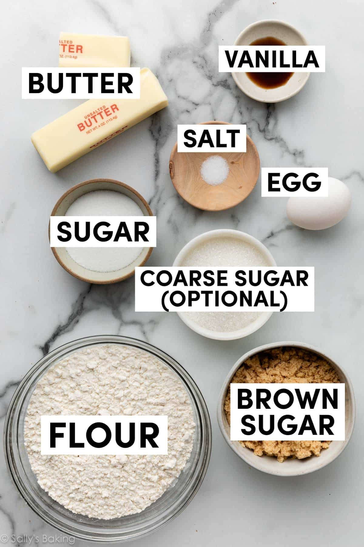 ingredients measured in bowls on marble counter.