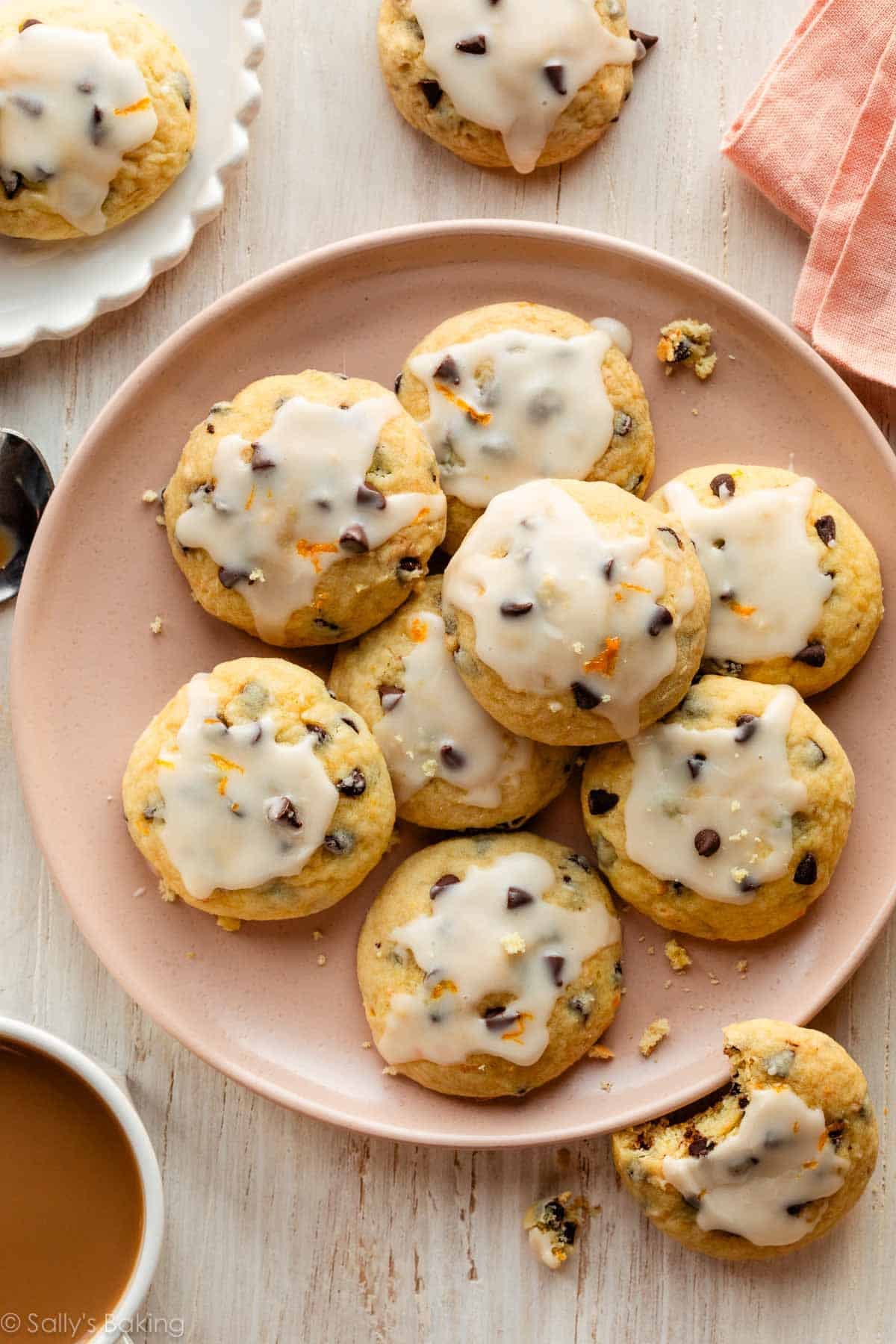 pink plate with orange chocolate chip ricotta cookies.