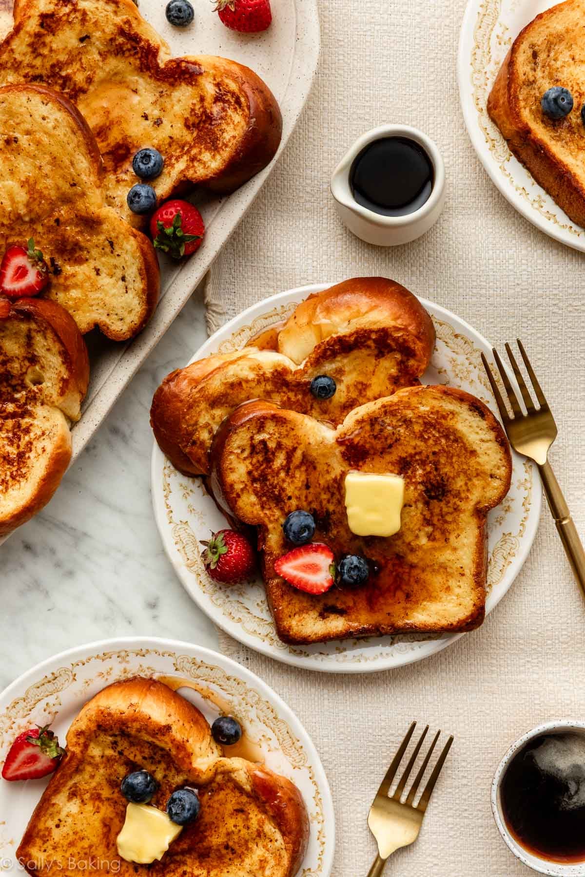 brioche french toast on plate and serving platter.