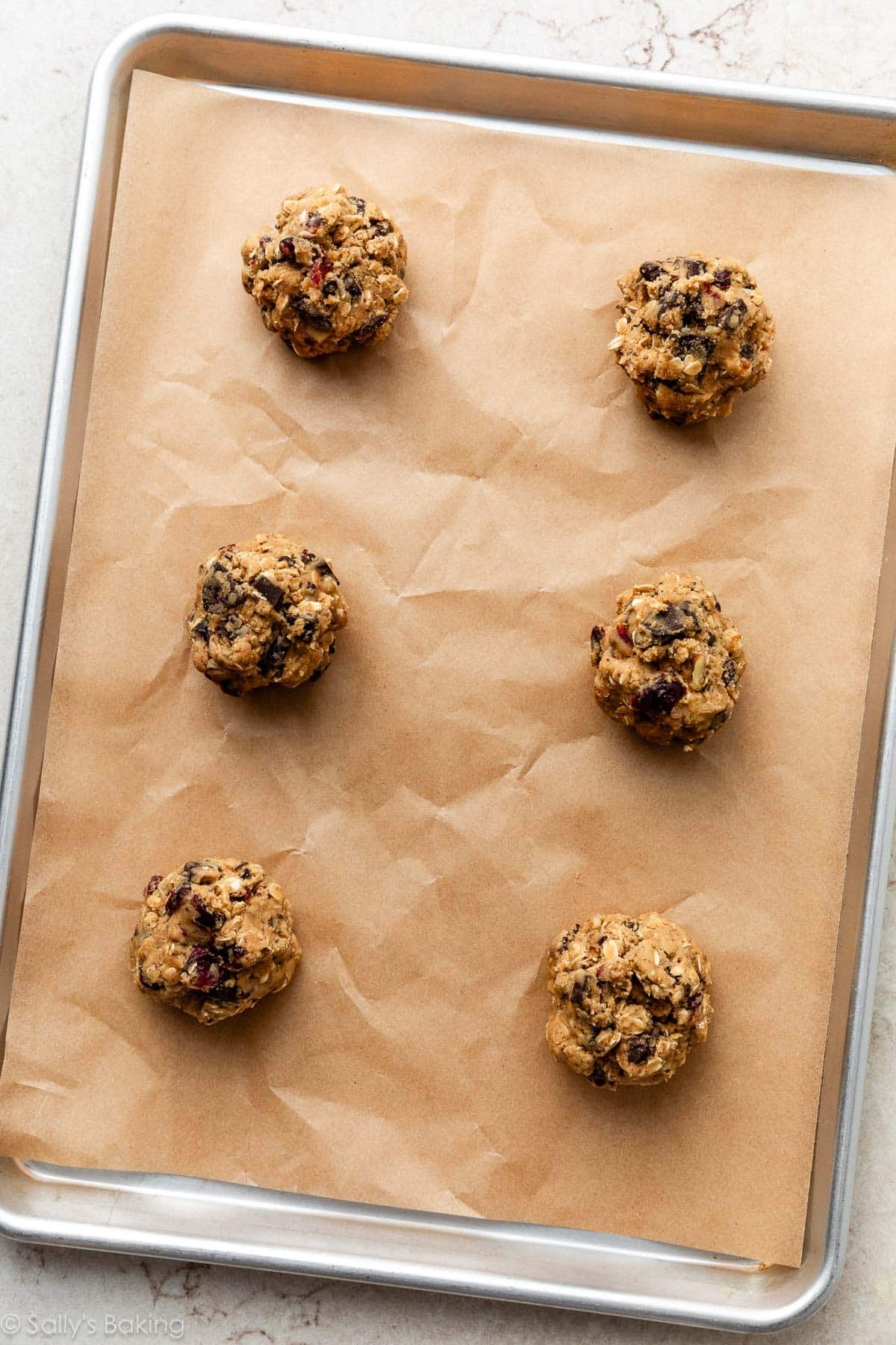 scooped and portioned cookie dough on baking sheet.