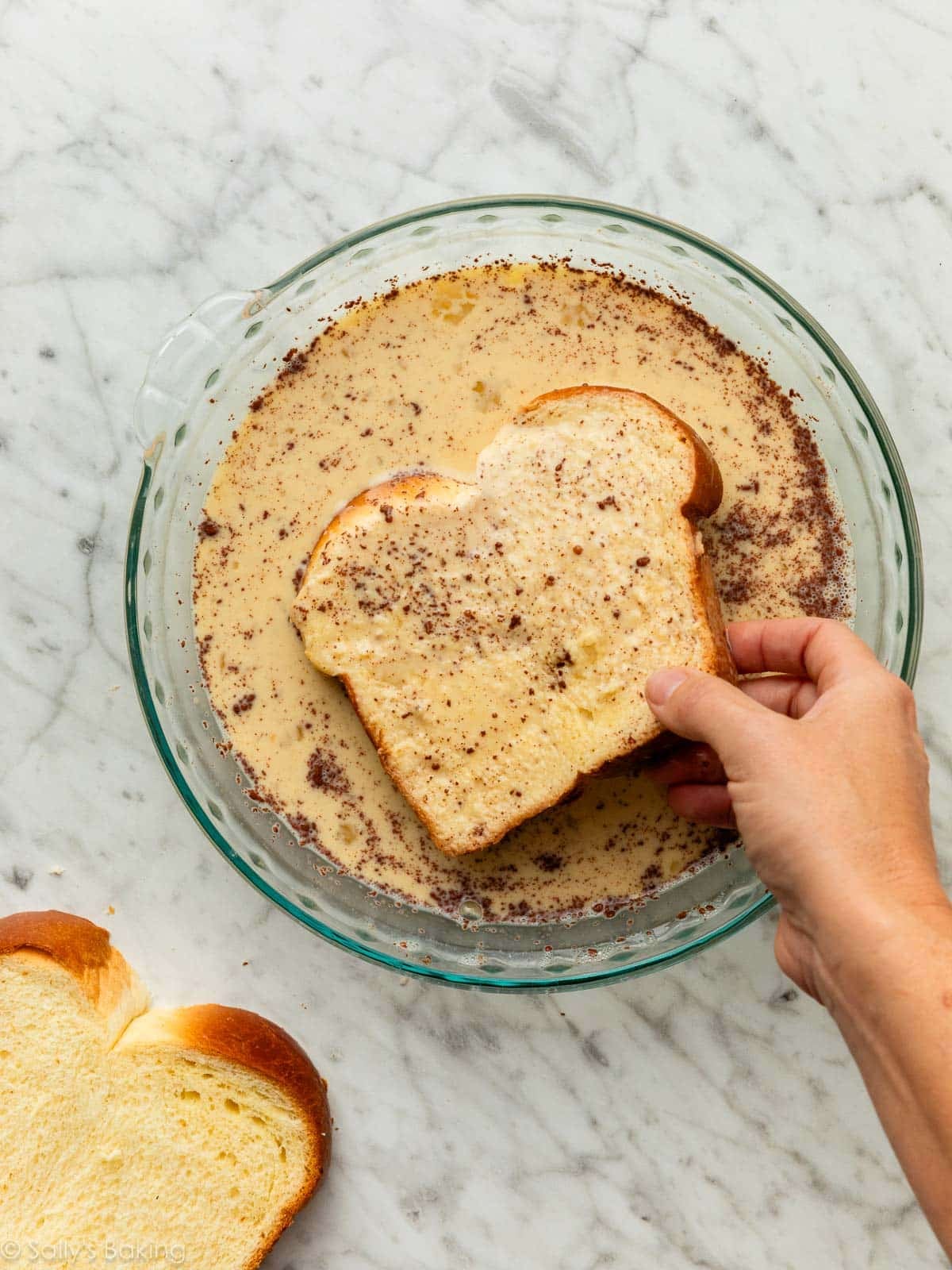 dipping bread slices in custard.