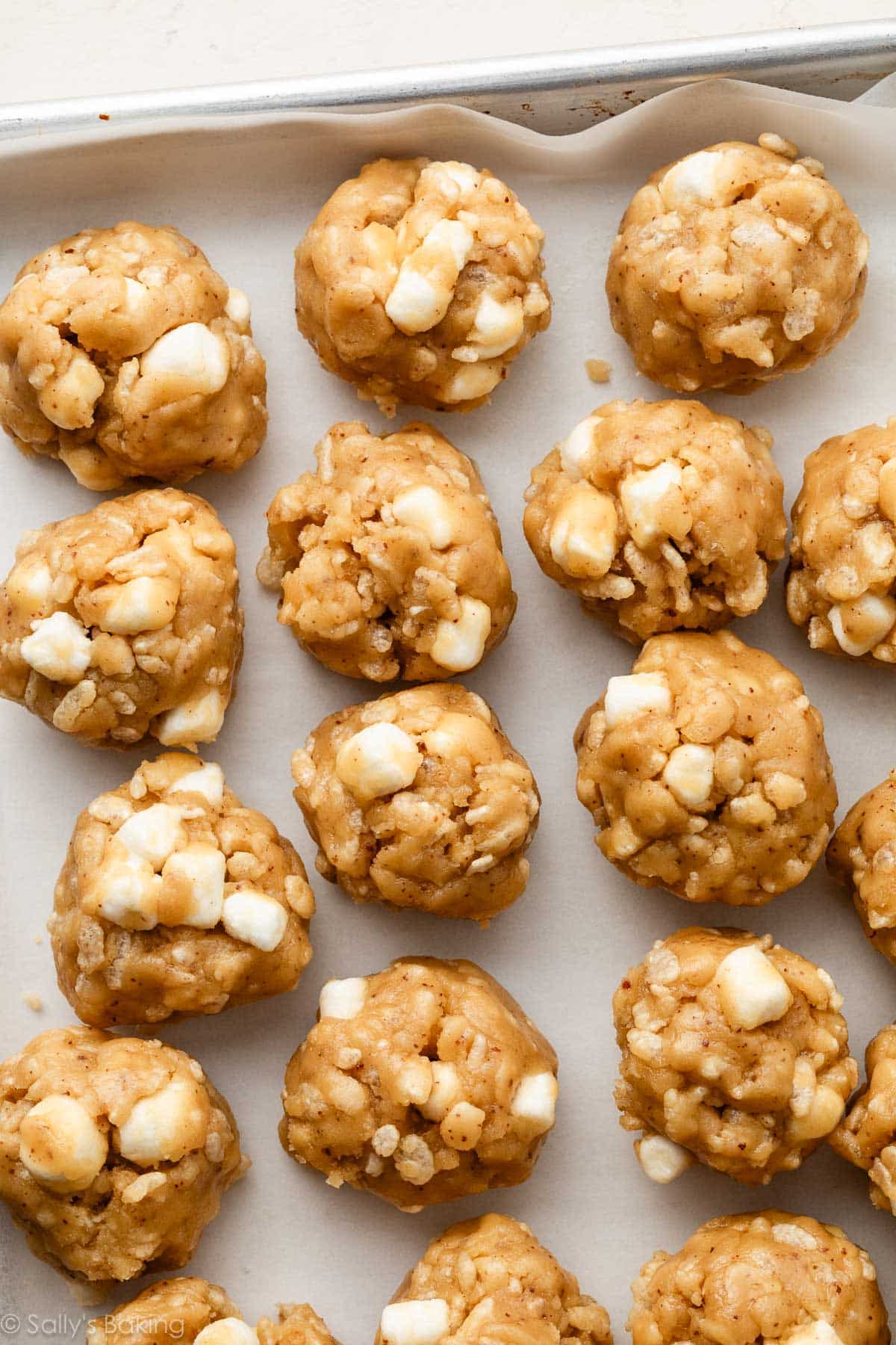 shaped dough balls with marshmallows inside.