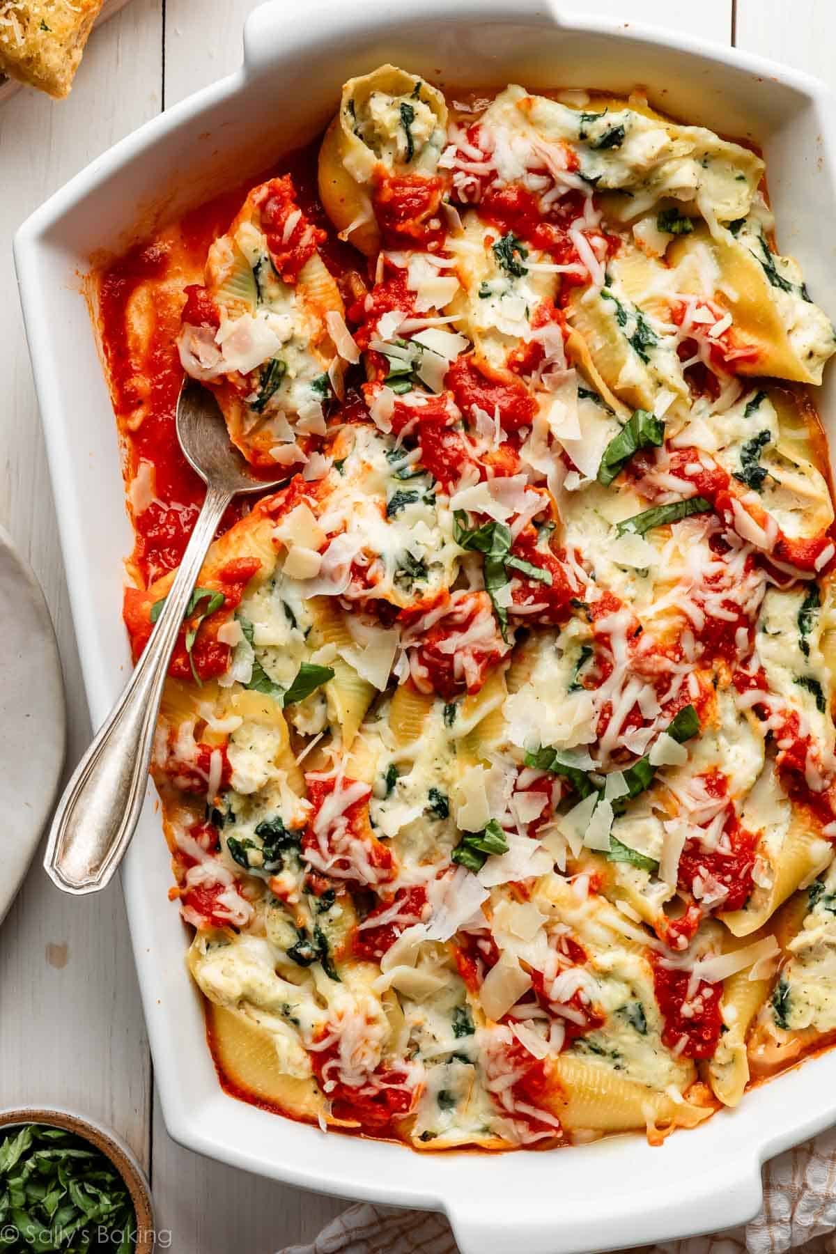stuffed shells with marinara, chicken, and spinach.