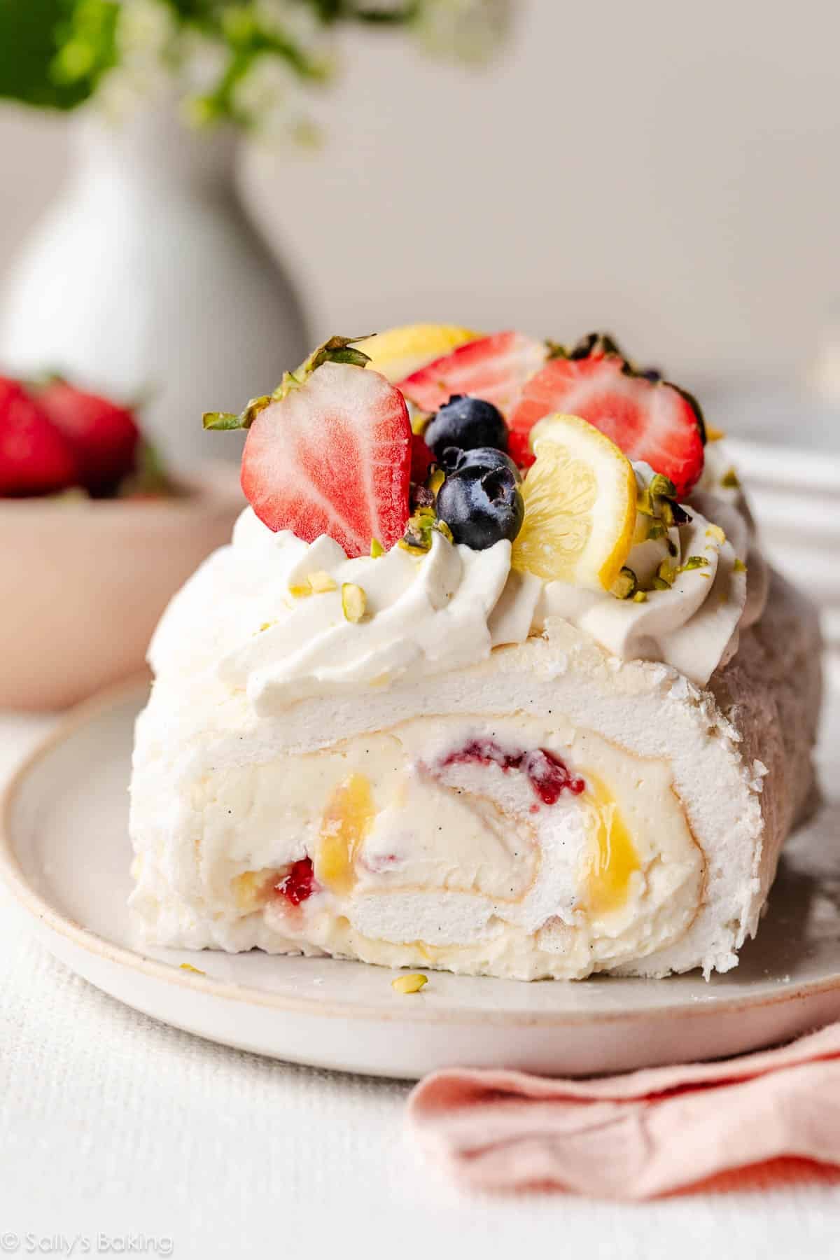 meringue roulade with fresh berries and lemon curd.